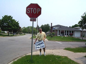 Councillor Paul Ainslie removing illegal signs